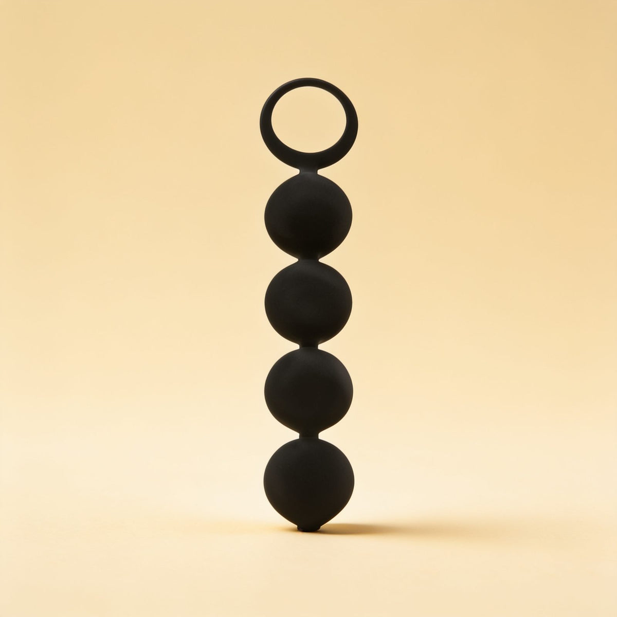 CHAPELET ANAL LENNON 4 SPHÈRES SILICONE 15 CM — packshot studio sur fond crème