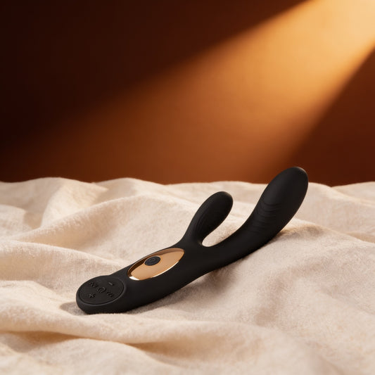 Vibromasseur couple E12 noir sur du lin, fond bronze