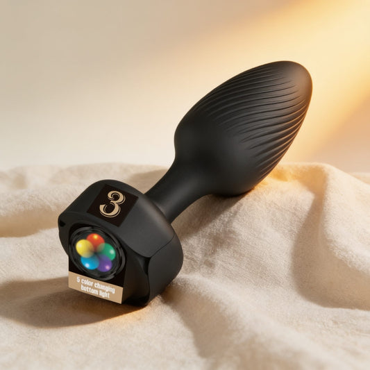 PLUG ANAL AVEC LUMIÈRE LED NOIR 9,8 CM — photo éditoriale sur lin drapé