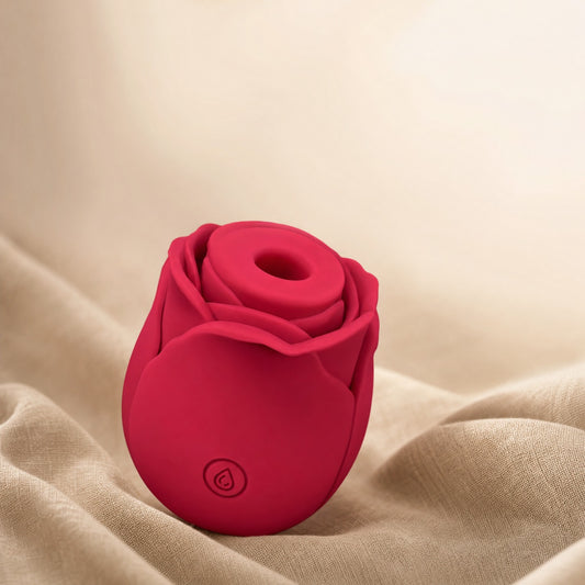 Stimulateur Rose Air Wave rouge sur du lin, fond ivoire