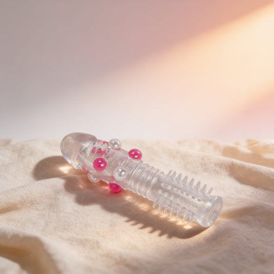 Gaine Silicon Sleeve avec billes — posée sur du lin drapé, lumière chaude