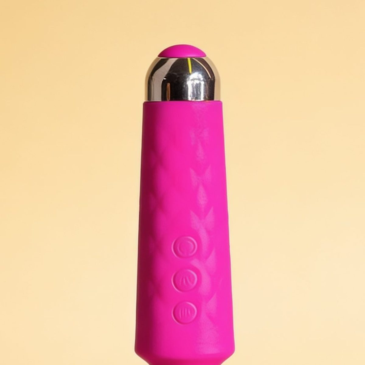 Vibromasseur wand rose Yoba — gros plan sur la tête et les commandes