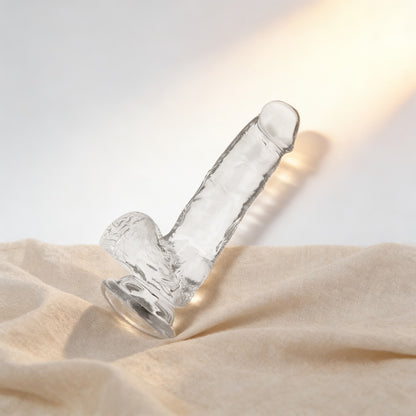 Gode transparent X-Ray avec testicules sur du lin, fond crème